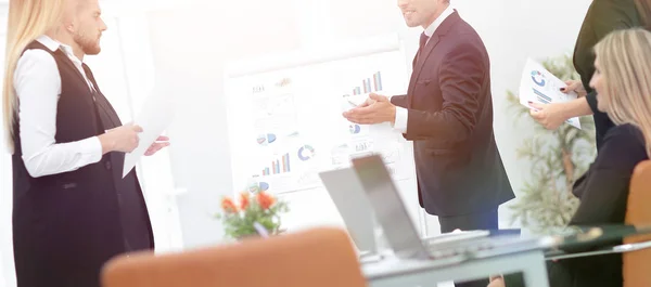 businessman makes a presentation to his business team