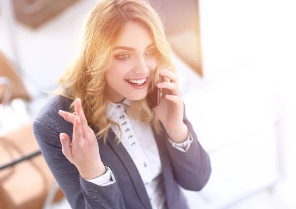 happy employee is talking on the smartphone