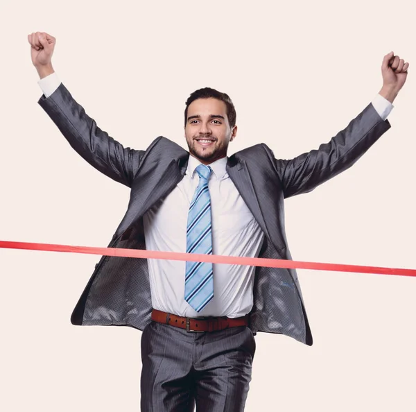 Triumphant businessman in front of the starting tape — Stock Photo, Image