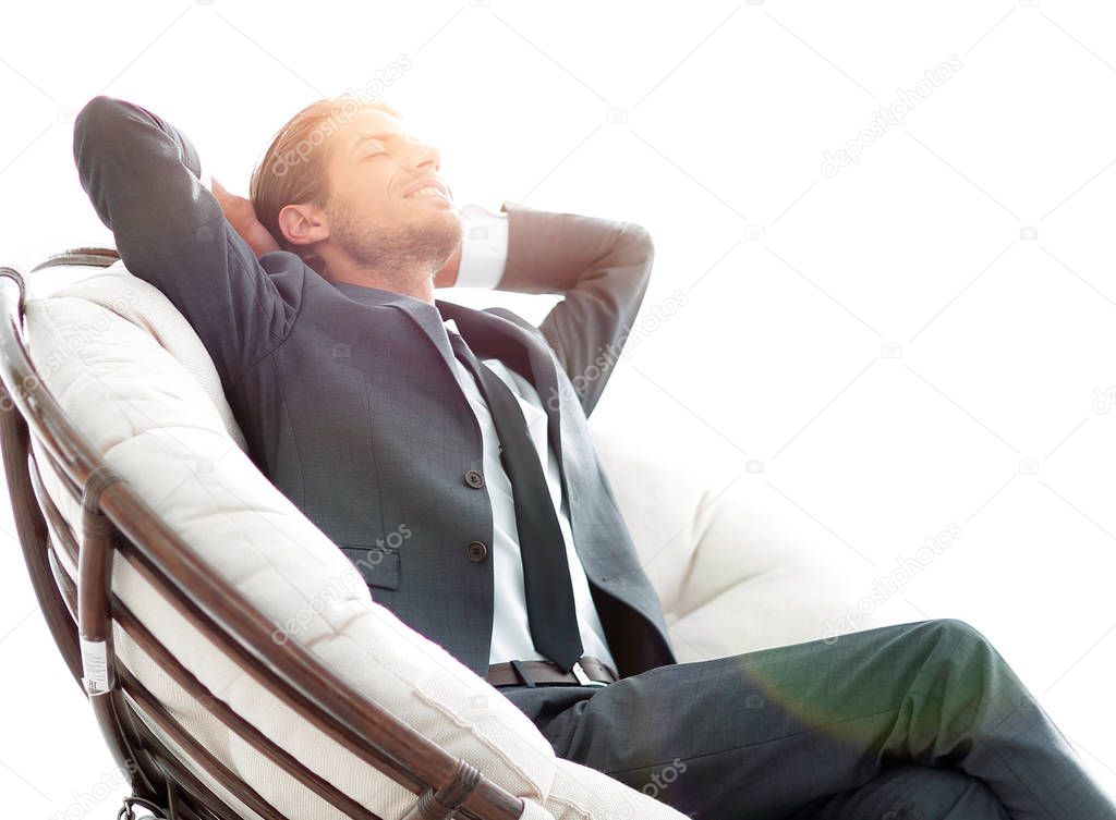 happy businessman relaxing in big comfortable armchair
