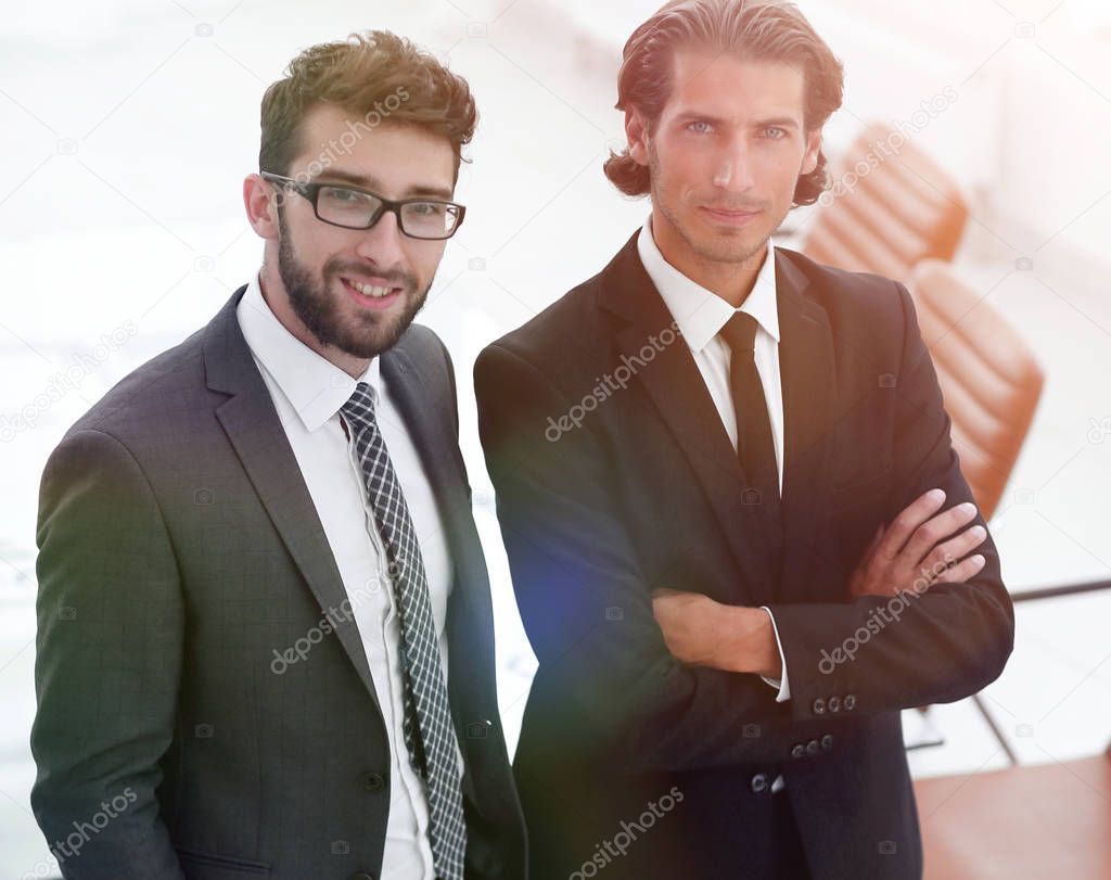 confident businessmen standing together in office