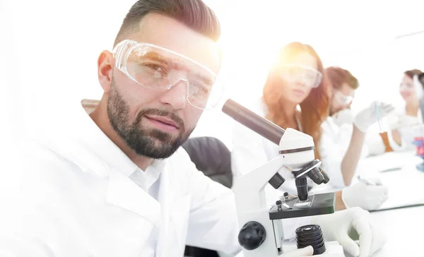 Close-up of a scientific researcher with microscope — Stock Photo, Image