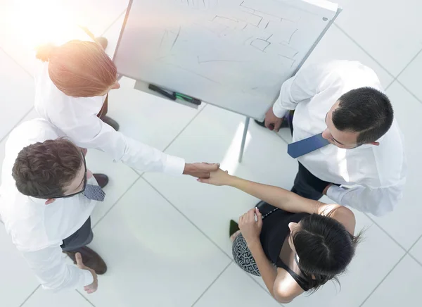 View from the top. the background image of a business handshake colleagues — Stock Photo, Image