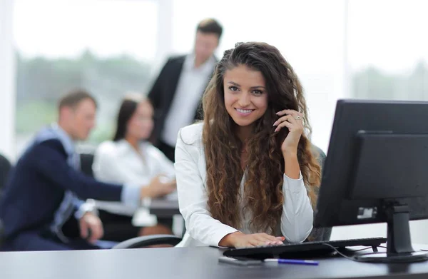 Manager woman sitting behind a Desk — Stock Photo, Image