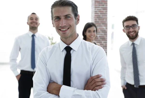 Portrait of a successful business person on the background of colleagues. — Stock Photo, Image