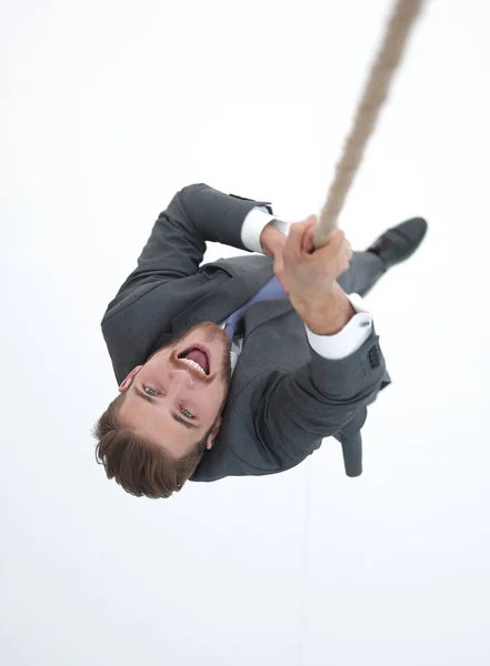 Успішний бізнесмен піднімається на мотузку — стокове фото