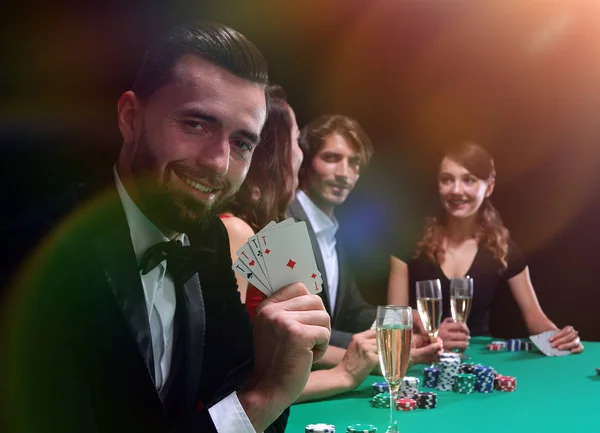 Handsome man playing in casino — Stock Photo, Image