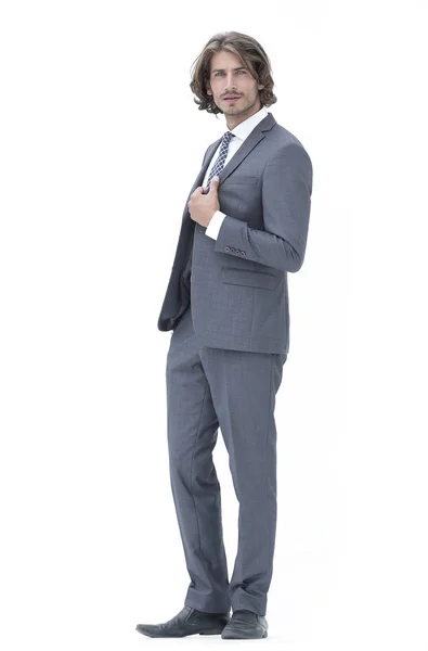 Businessman straightening his tie isolated on a white background — Stock Photo, Image