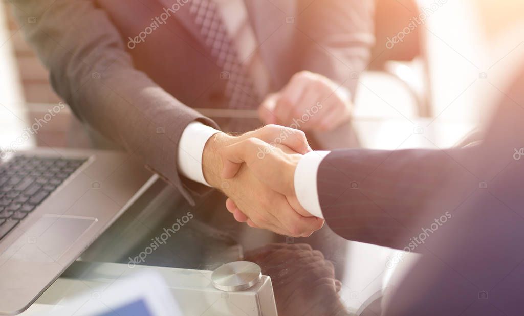 confident handshake of business partners
