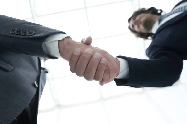 Two business people are holding hands to business cooperation. — Stock Photo, Image