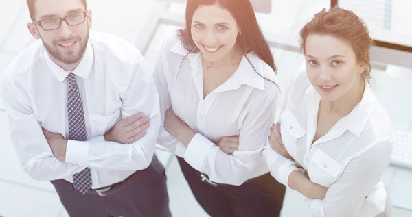 Successful business team standing near workplace — Stock Photo, Image