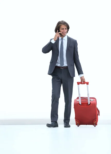Sukcesy biznesmen z bagażu rozmawia przez telefon. — Zdjęcie stockowe