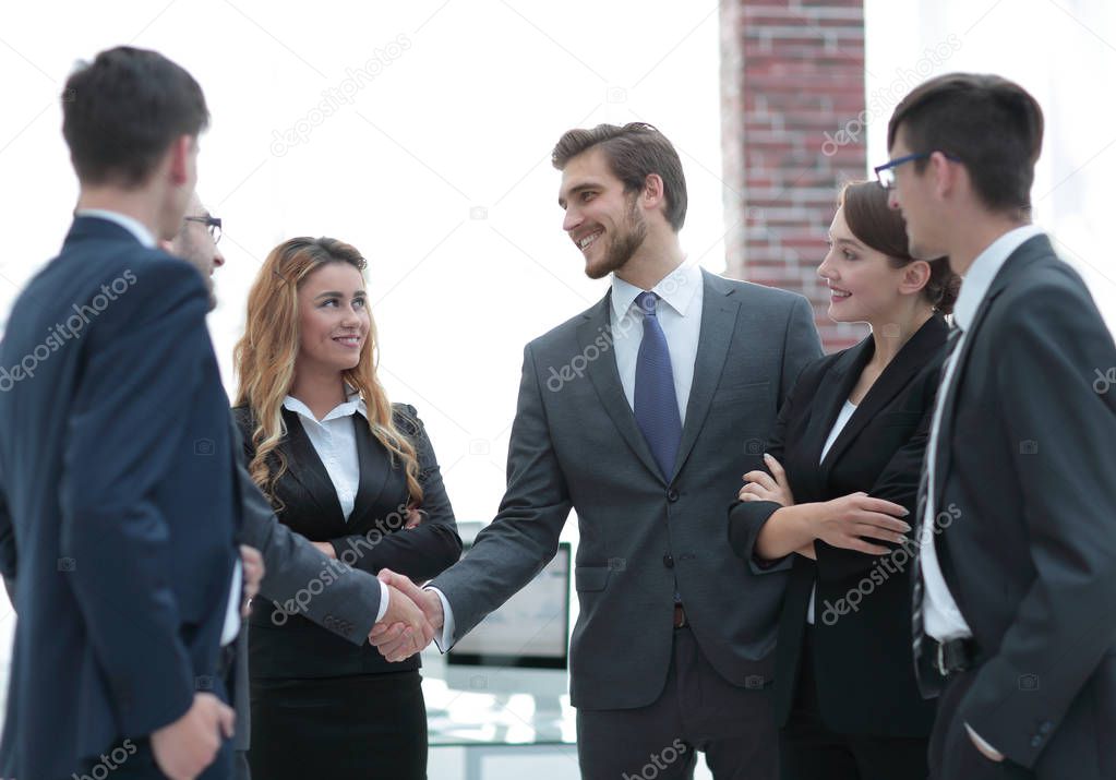 business handshake of businessmen in the office