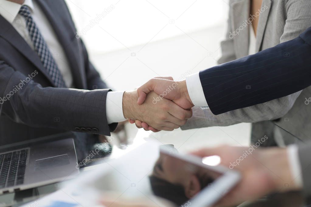 confident handshake of business partners