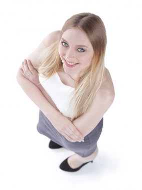 Yukarıdan görüntüleyin. Kameraya bakarak başarılı genç iş kadını.