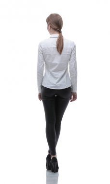 arka görüş. Kendine güvenen genç bir kadın tam growth.portrait içinde.