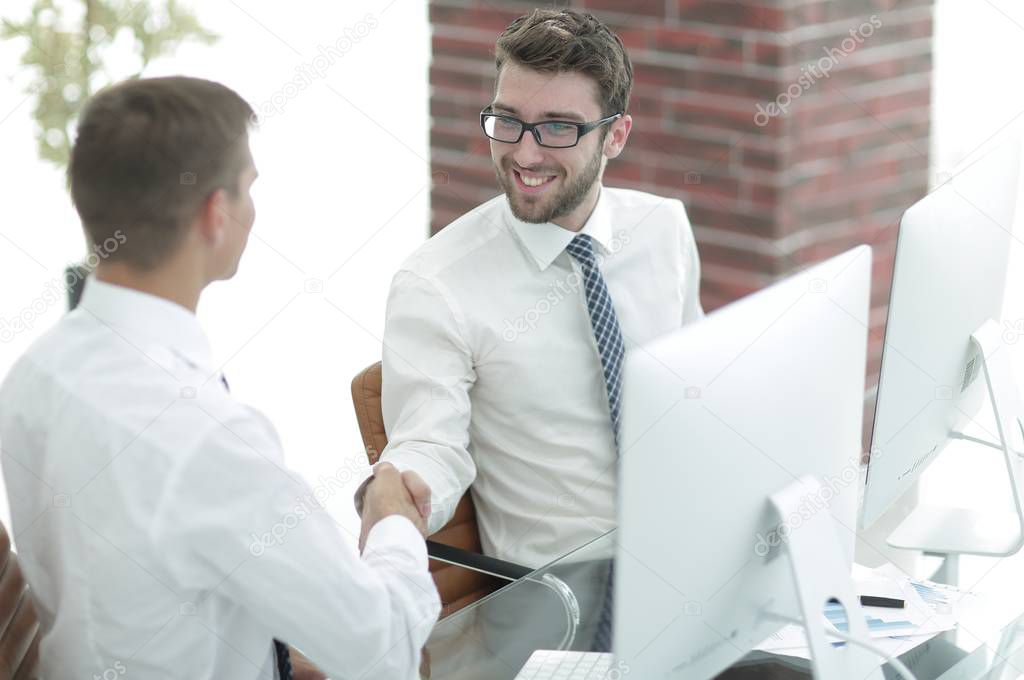 handshake Manager and customer in a modern office