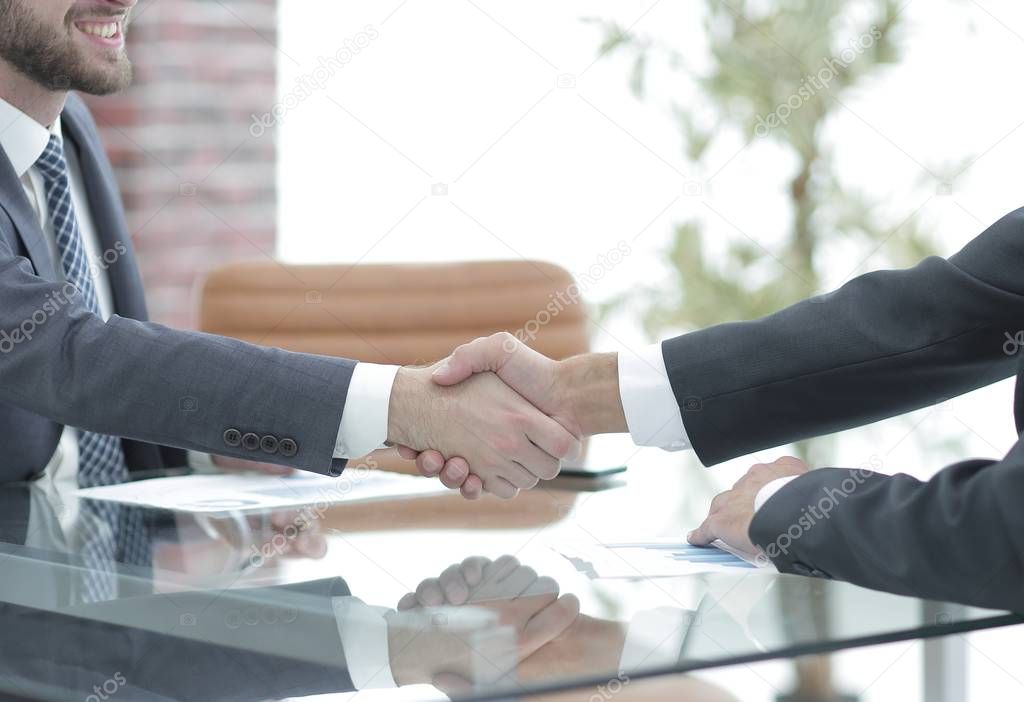 handshake of business partners on business negotiations