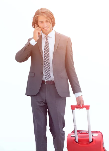 Successful businessman with Luggage talking on the phone. — Stock Photo, Image