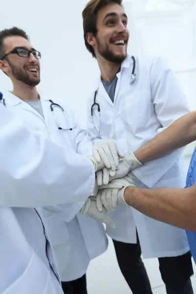 Group of doctors,clasped their hands together — Stock Photo, Image