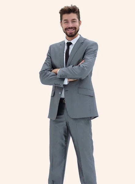 Pewny siebie biznesmenem w szary garnitur na białym tle — Zdjęcie stockowe