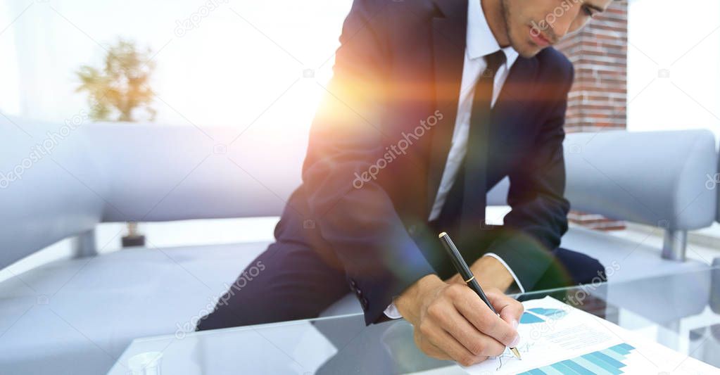 businessman working with a financial report.