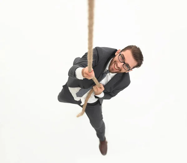 Empresário bem sucedido escalando a corda — Fotografia de Stock