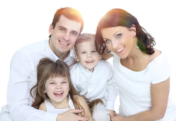 Smiling mother and father holding their children at home — Stock Photo, Image