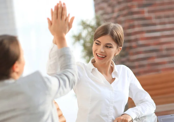 Members of the business team giving each other a high five. Stock Image