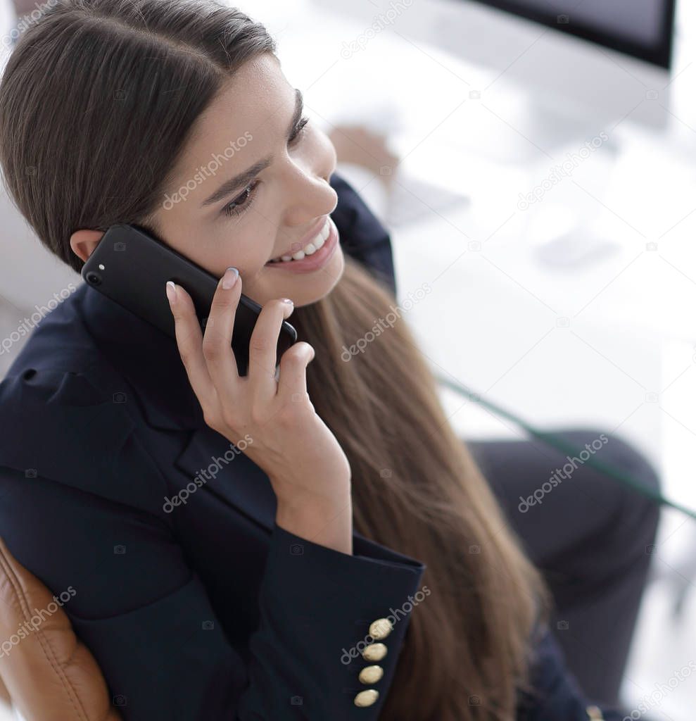 serious woman employee talking on his mobile