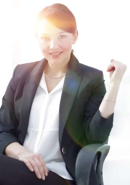 Closeup of a successful young business woman sitting at a Desk. — Stock Photo, Image