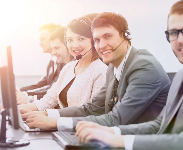 Customer service representative with headset in call center — Stock Photo, Image