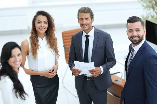 Employees standing in a modern office — Stock Photo, Image