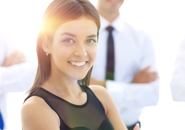 Young employee of the company, standing in front of their colleagues. — Stock Photo, Image