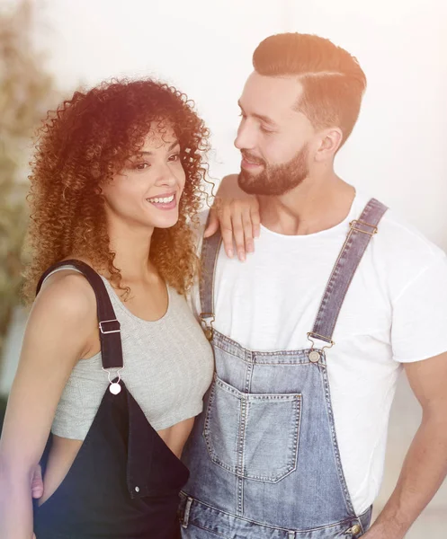 beautiful young couple standing in a new apartment. Photo has a