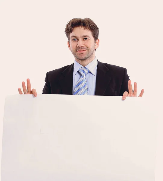 Empresário segurando um cartaz em branco — Fotografia de Stock