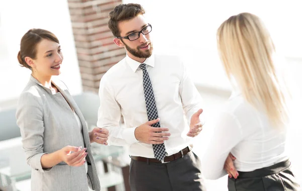 Manager and business team talking in the office.