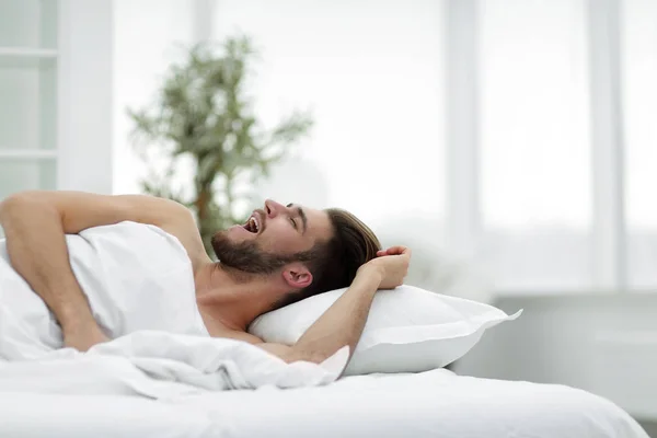 Business man falling asleep in the comfortable hotel room — Stock Photo, Image