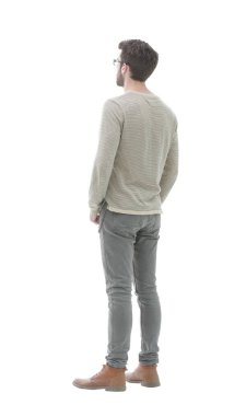 Arka görüş. Tam uzunlukta. Gri süveterli genç adam