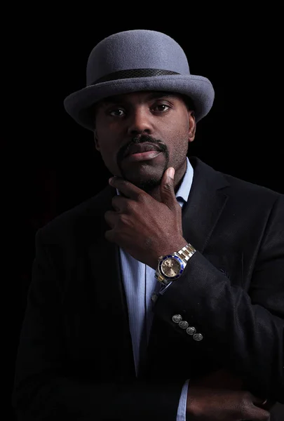 Image of handsome african man wearing hat posing in studio. — Stock Photo, Image