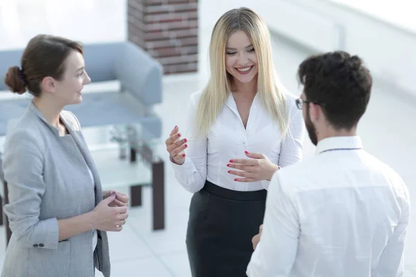 Closeup of business woman talking with a colleague — Stock Photo, Image