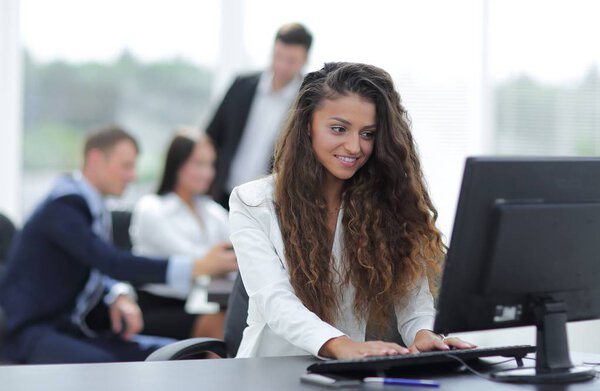 Manager woman sitting behind a Desk