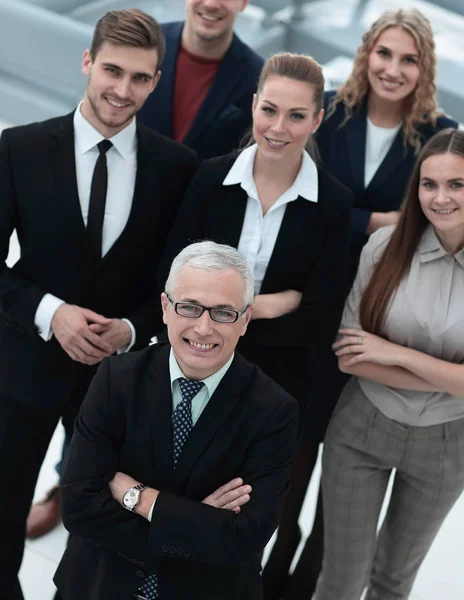 View from the top. group of smiling business people looking at camera. — Stock Photo, Image