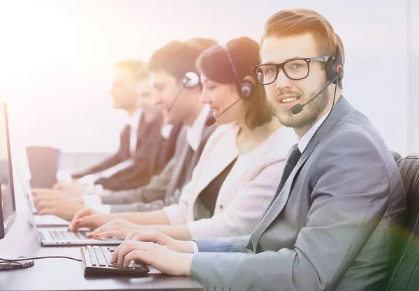 Operator call center with colleagues sitting at the workplace — Stock Photo, Image