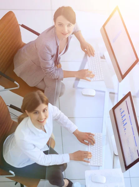 staff of the planning Department sitting behind a Desk and looki