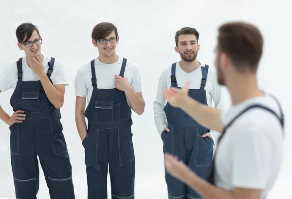 Cheerful team of responsible movers and their smiling leader. — Stock Photo, Image