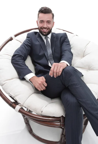 Empresário bem sucedido sentado em uma cadeira . — Fotografia de Stock