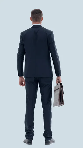 Vista posteriore.uomo d'affari fiducioso con valigetta — Foto Stock