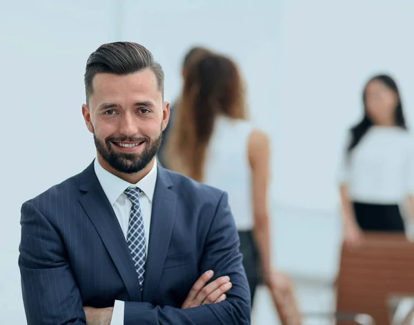Businessman on background of office. — Stock Photo, Image