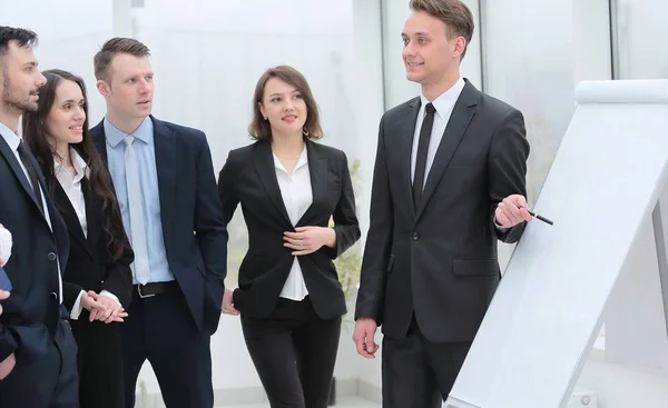 Businessman pointing pen on blank Board for presentation — Stock Photo, Image